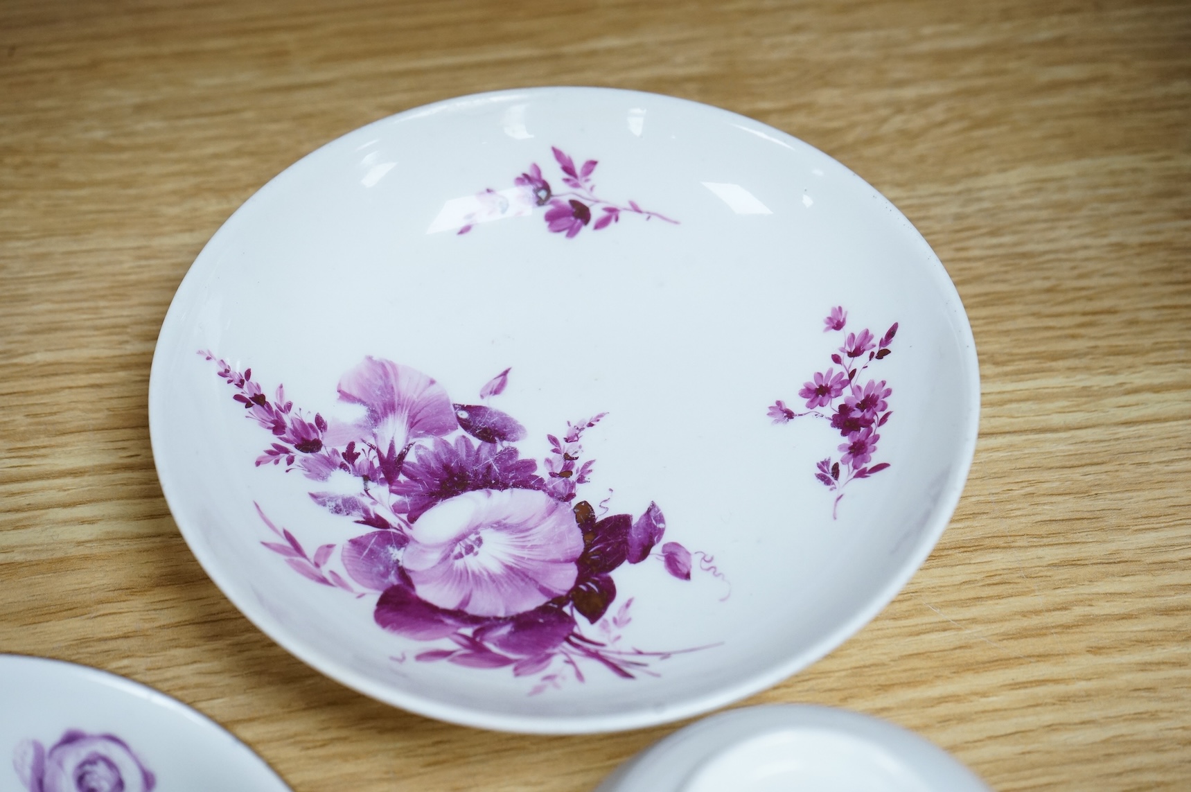 Two 18th century Meissen floral decorated teacups and saucers, largest saucer 13.5cm diameter